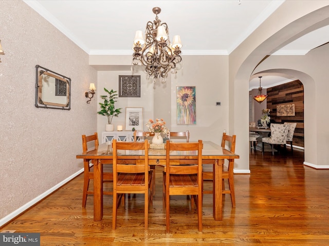 2503 Island Grove Blvd, Frederick, MD 21701 - dining room with arched walkways, a chandelier, wood finished floors, and crown molding