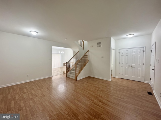 466 Sequoia Dr, Smyrna, DE 19977 - entrance foyer with stairway, wood finished floors, and a chandelier