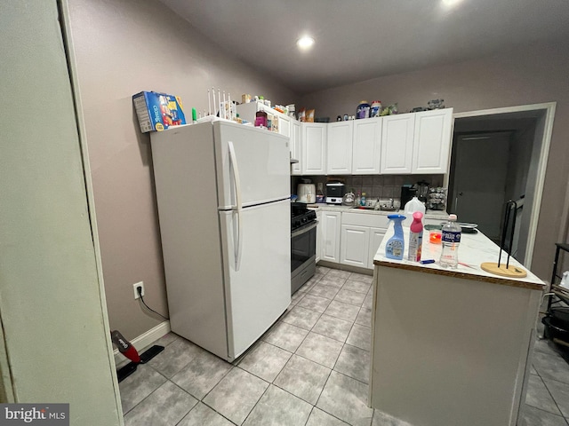 3102 N Taylor St, Philadelphia, PA 19132 - kitchen featuring freestanding refrigerator, stainless steel gas range oven, light tile patterned flooring, white cabinetry, and recessed lighting