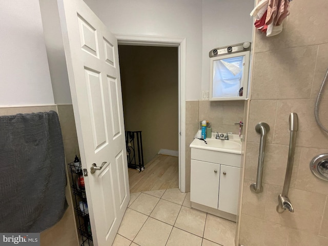3102 N Taylor St, Philadelphia, PA 19132 - bathroom featuring vanity, tile patterned flooring, and tile walls