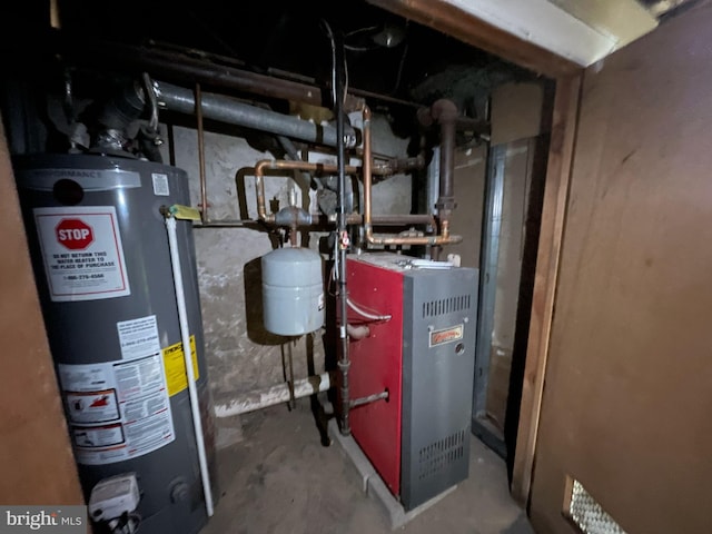 3102 N Taylor St, Philadelphia, PA 19132 - utility room featuring water heater and a heating unit