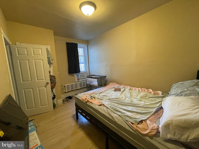 3102 N Taylor St, Philadelphia, PA 19132 - bedroom featuring light wood finished floors and radiator heating unit