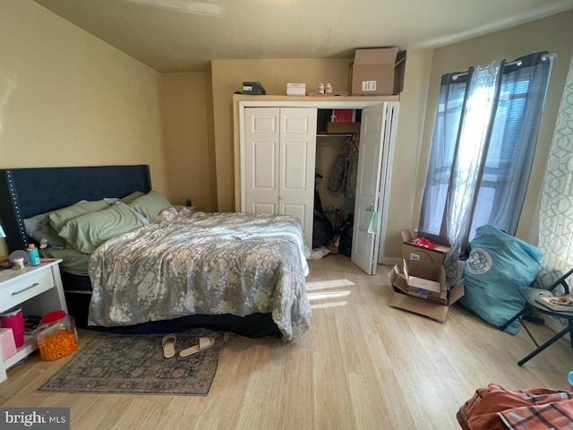 3102 N Taylor St, Philadelphia, PA 19132 - bedroom with light wood-style floors, multiple windows, and a closet
