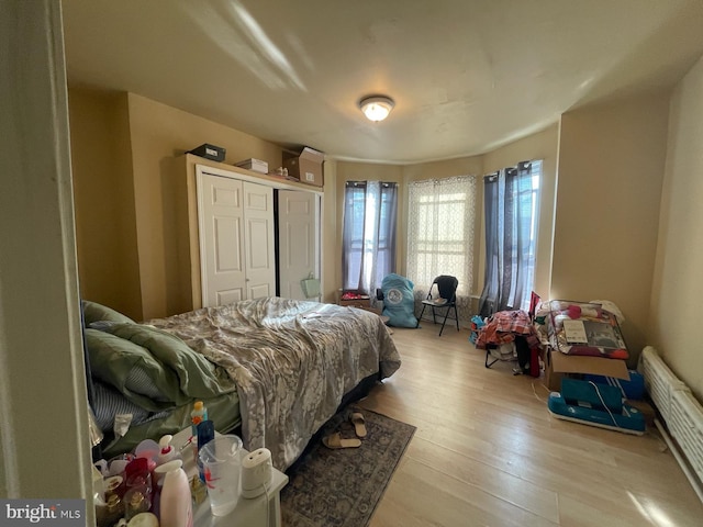 3102 N Taylor St, Philadelphia, PA 19132 - bedroom with wood finished floors, a closet, and an AC wall unit