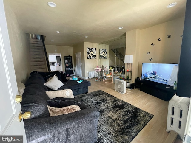 3102 N Taylor St, Philadelphia, PA 19132 - living room featuring wood finished floors, stairway, recessed lighting, and radiator