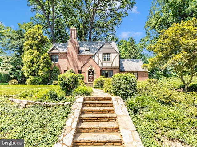5100 Brook Green Rd, Baltimore, MD 21229 - tudor-style house with brick siding and a chimney