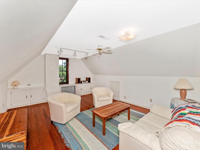 5100 Brook Green Rd, Baltimore, MD 21229 - living area featuring rail lighting, wood finished floors, lofted ceiling, radiator, and a ceiling fan