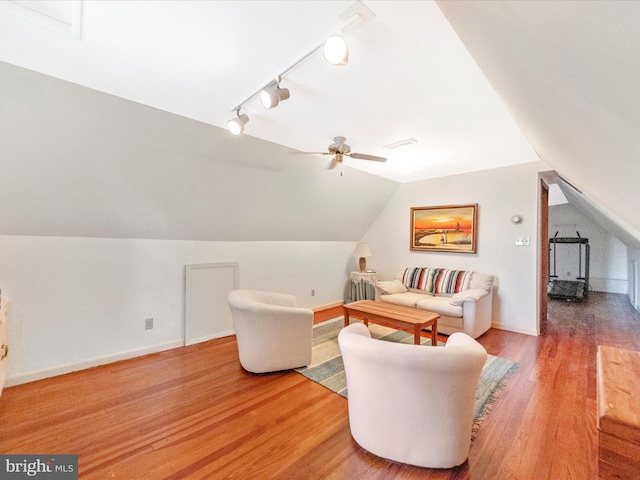 5100 Brook Green Rd, Baltimore, MD 21229 - living room featuring wood finished floors, rail lighting, lofted ceiling, and ceiling fan