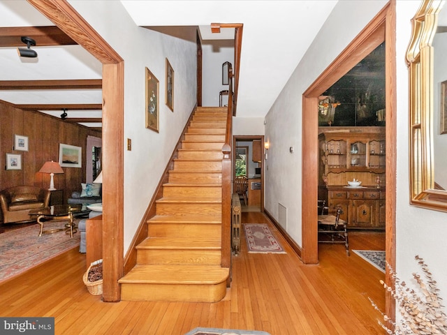 5100 Brook Green Rd, Baltimore, MD 21229 - staircase featuring hardwood / wood-style flooring and beam ceiling