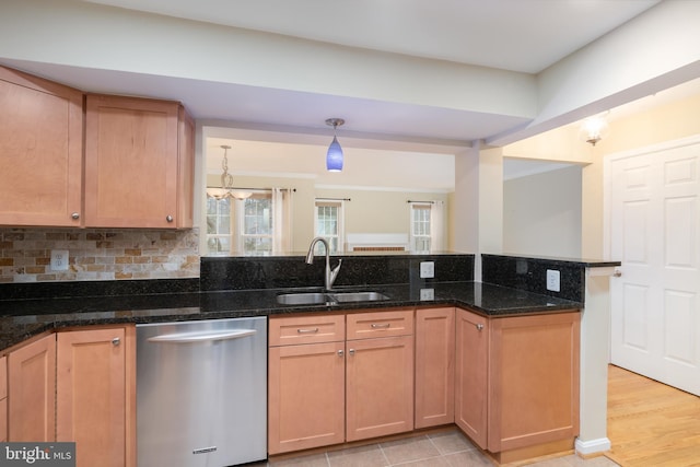 1906 Duffield Ln, Alexandria, VA 22307 - kitchen with stainless steel dishwasher, dark stone counters, pendant lighting, and backsplash