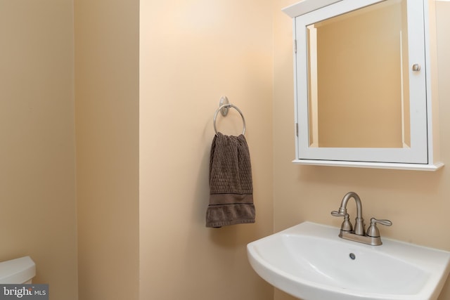 1906 Duffield Ln, Alexandria, VA 22307 - half bathroom featuring a sink and toilet