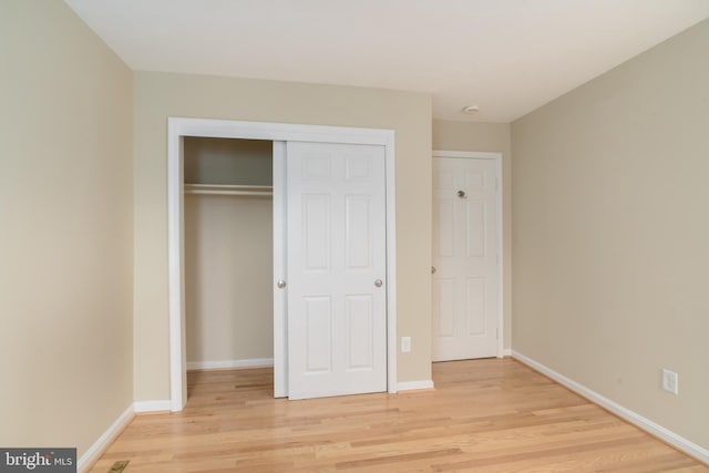 1906 Duffield Ln, Alexandria, VA 22307 - unfurnished bedroom featuring light wood finished floors and a closet