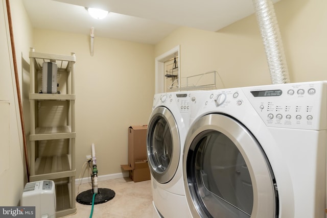 1906 Duffield Ln, Alexandria, VA 22307 - laundry room featuring separate washer and dryer and light tile patterned floors