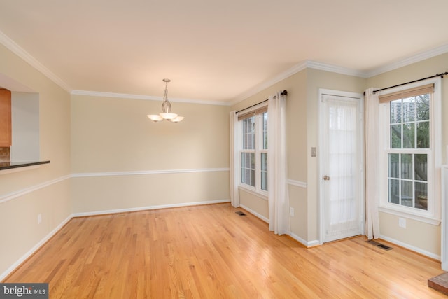 1906 Duffield Ln, Alexandria, VA 22307 - unfurnished dining area featuring a chandelier, light wood-type flooring, and ornamental molding