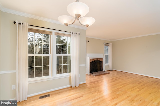 1906 Duffield Ln, Alexandria, VA 22307 - unfurnished living room with wood finished floors, a chandelier, ornamental molding, and a fireplace