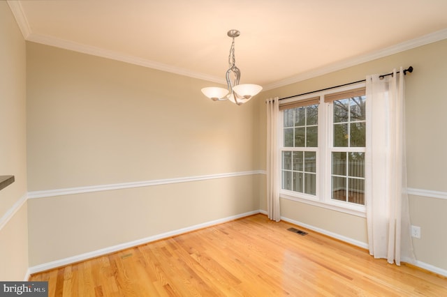 1906 Duffield Ln, Alexandria, VA 22307 - empty room featuring light wood finished floors, a chandelier, and crown molding