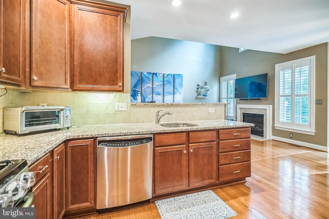 2350 Rosemont Ter, Furlong, PA 18925 - kitchen featuring dishwasher, a peninsula, stove, decorative backsplash, and light stone countertops