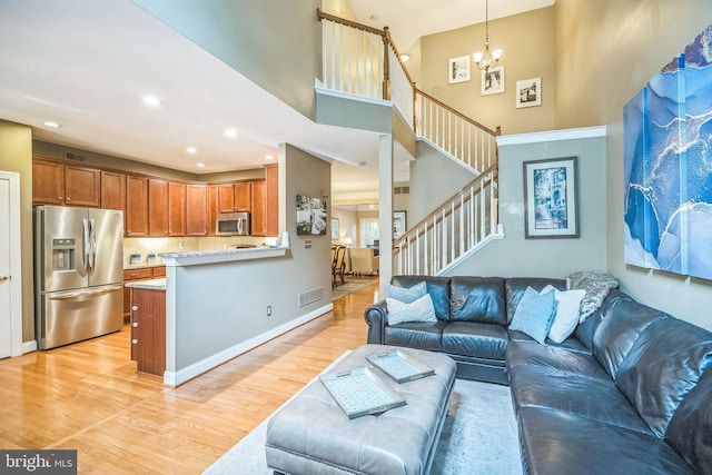 2350 Rosemont Ter, Furlong, PA 18925 - living room with a high ceiling, light wood-type flooring, a chandelier, stairway, and recessed lighting