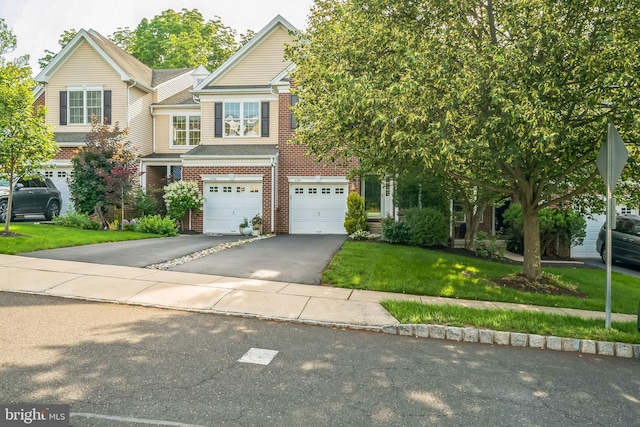 2350 Rosemont Ter, Furlong, PA 18925 - view of front facade with driveway, a garage, brick siding, and a front yard