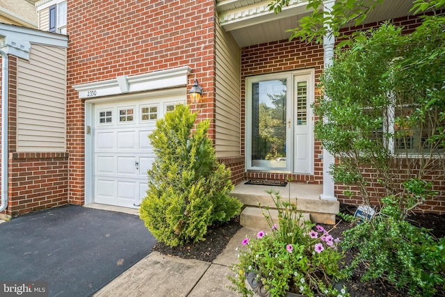 2350 Rosemont Ter, Furlong, PA 18925 - entrance to property featuring brick siding, a garage, and asphalt driveway