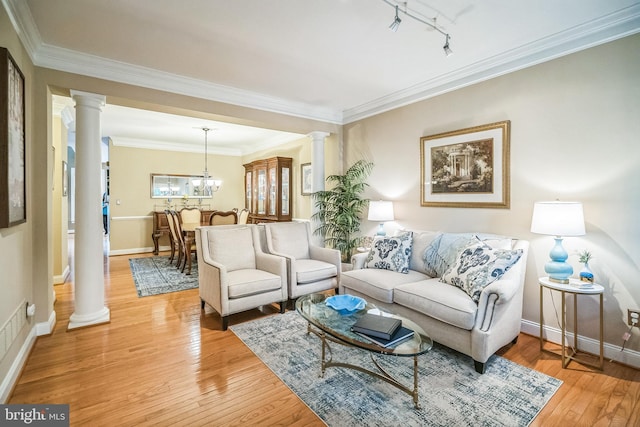 2350 Rosemont Ter, Furlong, PA 18925 - living area with ornate columns, track lighting, light wood finished floors, ornamental molding, and a chandelier