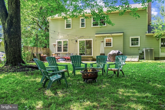 8614 Braeburn Dr, Annandale, VA 22003 - back of property featuring a fire pit, a chimney, and a shingled roof
