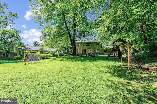 8614 Braeburn Dr, Annandale, VA 22003 - view of grassy yard featuring a playground