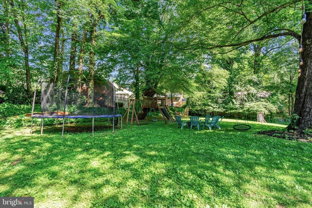 8614 Braeburn Dr, Annandale, VA 22003 - view of yard featuring a playground and a trampoline