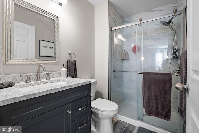 28 Powell Ct, Hightstown, NJ 08520 - bathroom featuring vanity, a shower stall, and wood finished floors