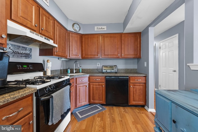 28 Powell Ct, Hightstown, NJ 08520 - kitchen featuring black appliances, range hood, light wood finished floors, and brown cabinets