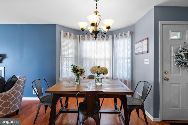 28 Powell Ct, Hightstown, NJ 08520 - dining room featuring a chandelier, plenty of natural light, and wood finished floors
