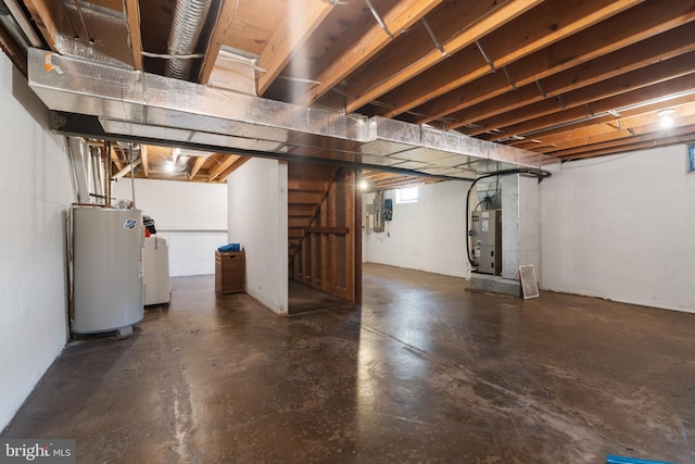 154 S Main St, Dublin, PA 18917 - basement featuring electric water heater, heating unit, washer / dryer, and concrete block wall