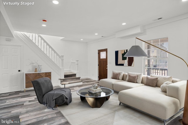 2305 James St, Baltimore, MD 21230 - living area with wood finished floors, stairs, and recessed lighting
