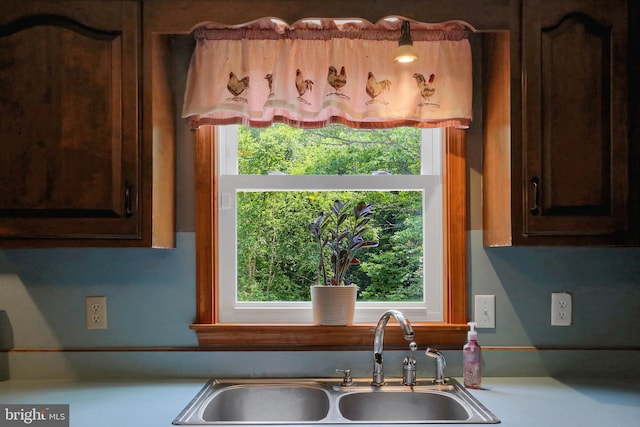 937 Meadow Ln, Millersburg, PA 17061 - kitchen featuring dark brown cabinets, light countertops, and plenty of natural light