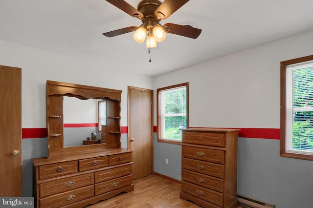 937 Meadow Ln, Millersburg, PA 17061 - bedroom featuring baseboard heating, light wood-style flooring, and ceiling fan