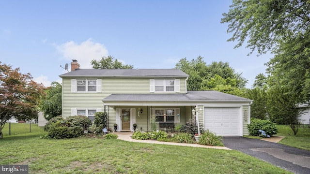 12502 Kilbourne Ln, Bowie, MD 20715 - traditional home featuring an attached garage, a chimney, covered porch, a front yard, and driveway