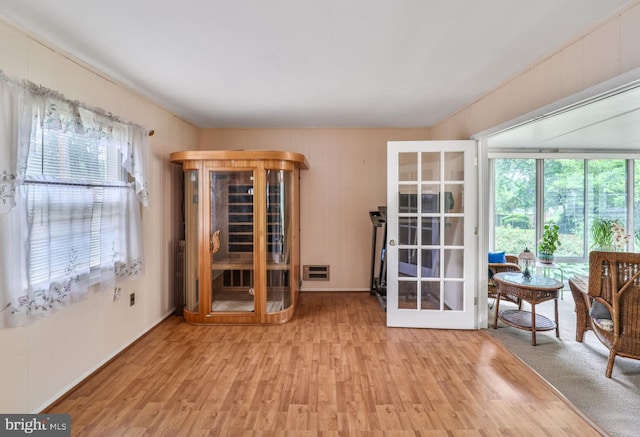 12502 Kilbourne Ln, Bowie, MD 20715 - unfurnished room featuring wood finished floors, french doors, and wood walls