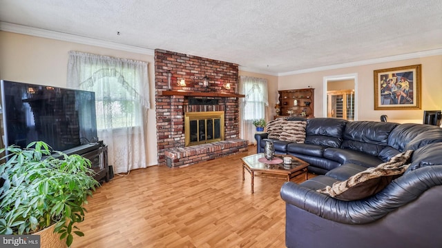 12502 Kilbourne Ln, Bowie, MD 20715 - living area featuring a brick fireplace, a textured ceiling, wood finished floors, and crown molding