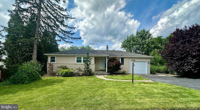 2475 Wharton Rd, York, PA 17402 - ranch-style house featuring driveway, a garage, a front lawn, and brick siding