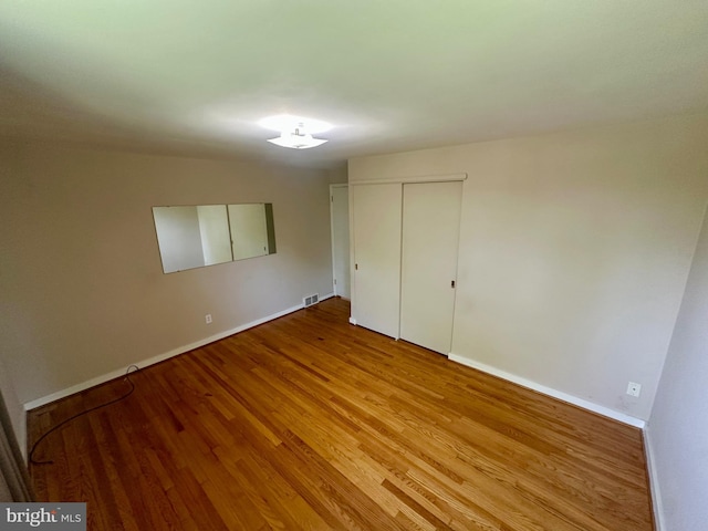 2475 Wharton Rd, York, PA 17402 - unfurnished bedroom with light wood-style flooring and a closet