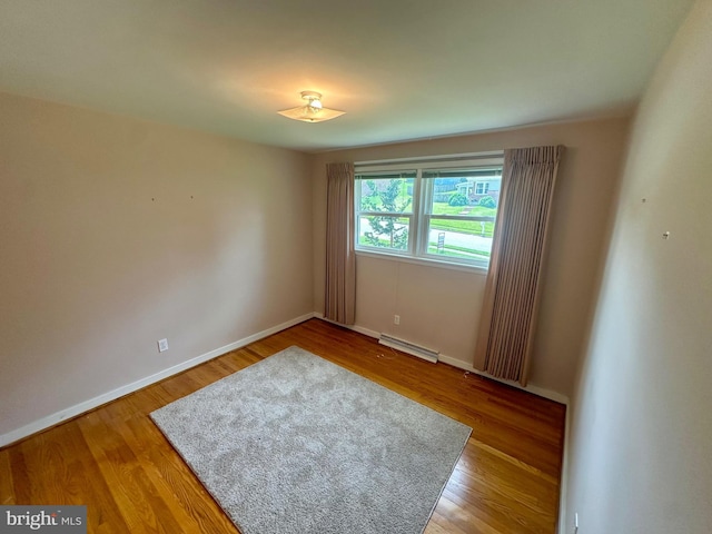 2475 Wharton Rd, York, PA 17402 - unfurnished room with baseboard heating and wood finished floors