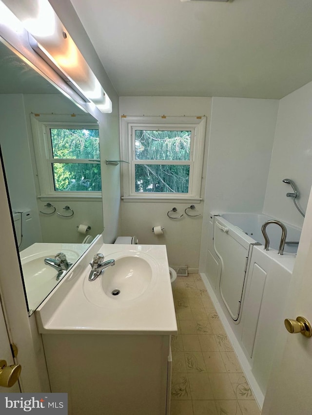 2475 Wharton Rd, York, PA 17402 - bathroom featuring plenty of natural light, vanity, a bath, and tile patterned floors