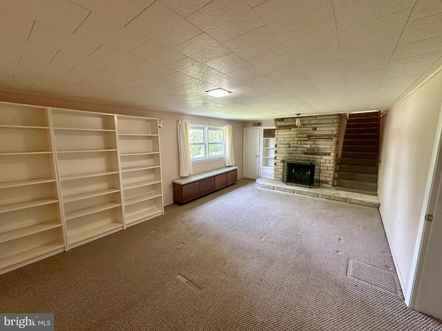 2475 Wharton Rd, York, PA 17402 - unfurnished living room with carpet flooring and a stone fireplace