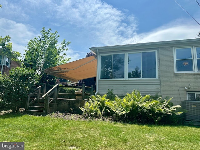 2475 Wharton Rd, York, PA 17402 - view of home's exterior featuring a yard and brick siding