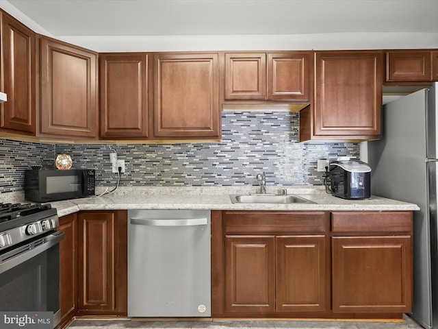 200 Erin Way Unit 204, Reisterstown, MD 21136 - kitchen featuring appliances with stainless steel finishes, tasteful backsplash, and light stone countertops