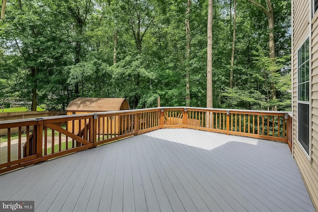 16715 Tintagel Ct, Dumfries, VA 22025 - wooden deck featuring a storage unit and a fenced backyard