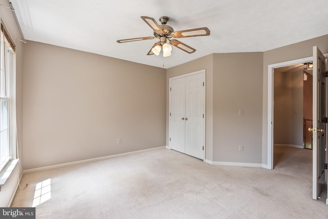 16715 Tintagel Ct, Dumfries, VA 22025 - unfurnished bedroom featuring light carpet, a closet, and a ceiling fan