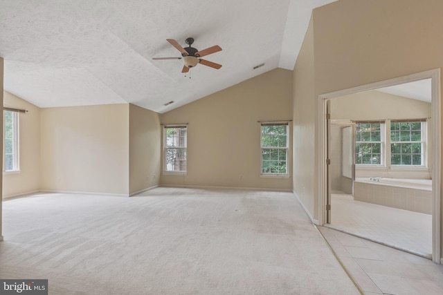16715 Tintagel Ct, Dumfries, VA 22025 - unfurnished room with plenty of natural light, a ceiling fan, carpet floors, a textured ceiling, and high vaulted ceiling
