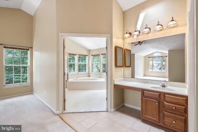 16715 Tintagel Ct, Dumfries, VA 22025 - full bathroom featuring vaulted ceiling, vanity, a bath, plenty of natural light, and a ceiling fan