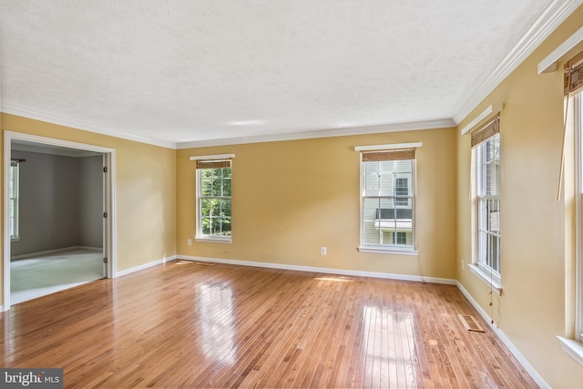 16715 Tintagel Ct, Dumfries, VA 22025 - empty room with light wood-style floors, a textured ceiling, and crown molding